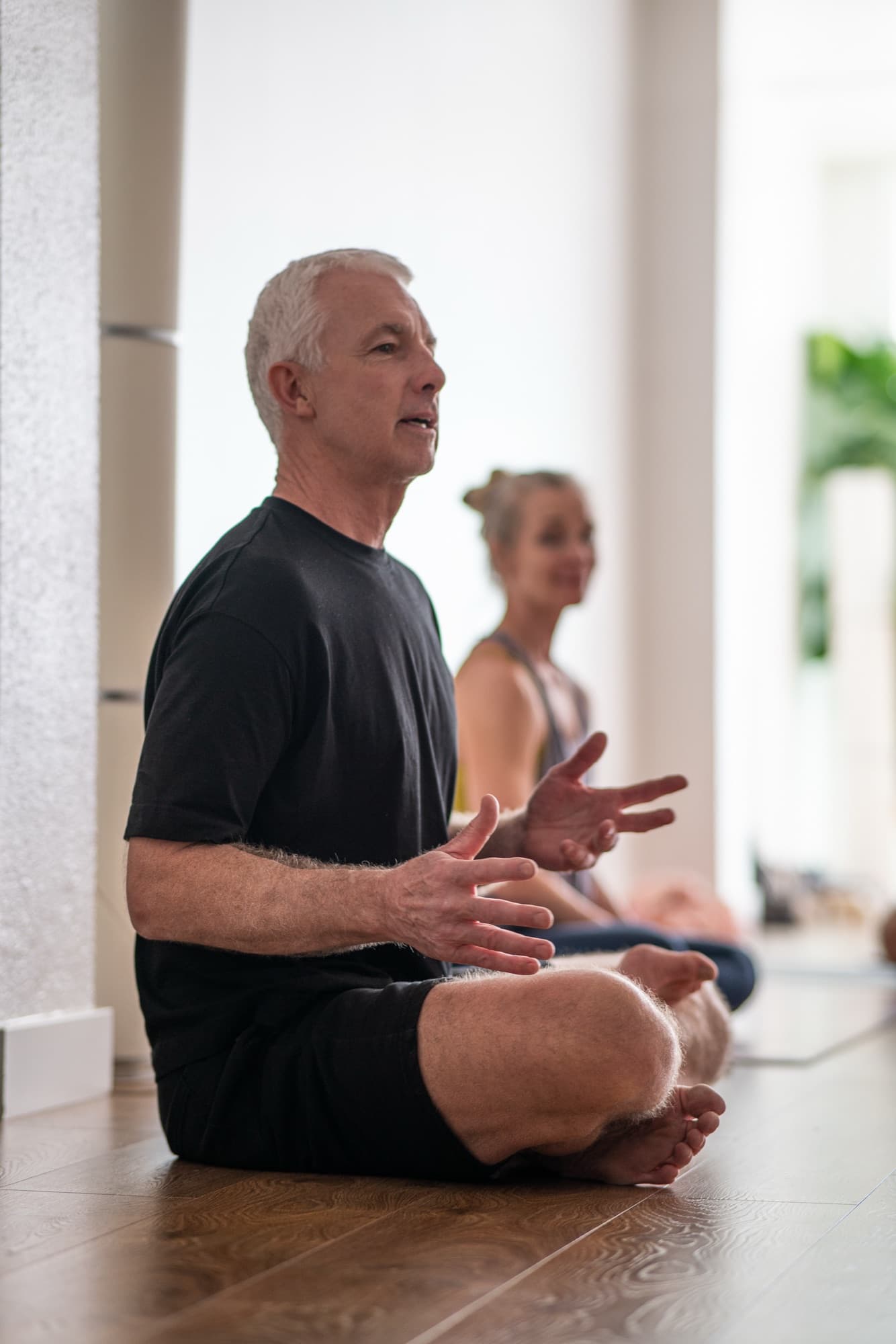 A student in seated meditation during class